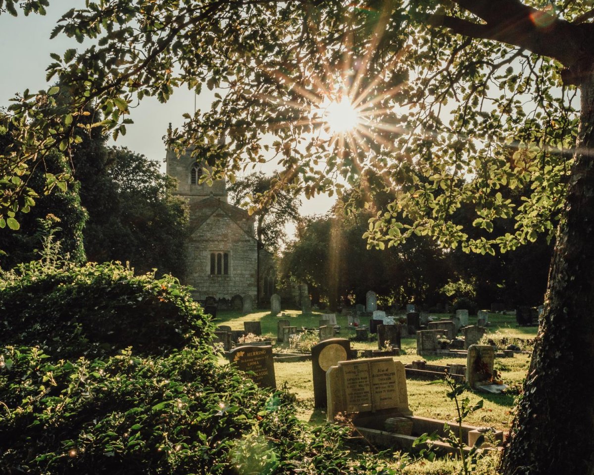 Golden Hour at St Andrews by Emily Robinson - 'There has been a church on this site in Immingham for over 800 years and it humbles me to think of all the lives that have come before us and will continue after us under the same sun. I took this image of the west side of the Church during golden hour on a summer’s evening and it is a side of the Church that often goes unnoticed. A narrow aperture enabled me to capture 
the sun as a starburst to tell the story of God’s everlasting and 
watchful eye over us - past, present and future.' (St Andrew’s 
Church, Immingham, North East Lincolnshire)